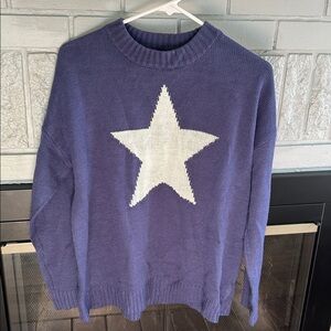 Knitted blue sweater with white star
